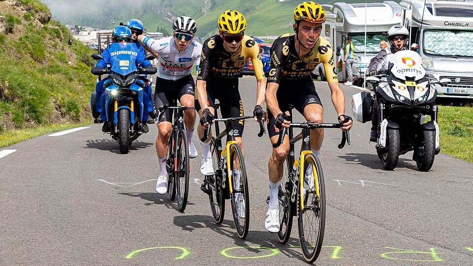 3 riders, Sepp Kuss, Jonas Vingegaard and Tadej Pogacar climbing the Tourmalet during stage 6 of the 2023 Tour de France